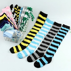 Detailed display of colorful striped over-the-knee socks in a cotton blend fabric