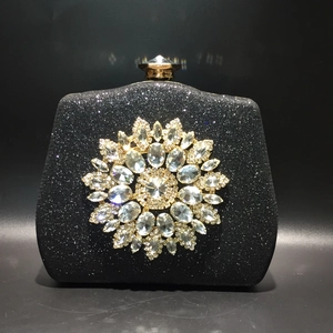 Elegant black glitter evening clutch with sunflower crystal ornament and gold metal clasp