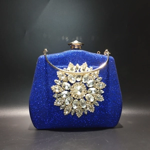 Blue sequin evening clutch bag with sparkling sunflower rhinestone and gold handle