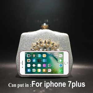 Detail of silver evening clutch bag with crystal sunflower showing iPhone 7 Plus capacity