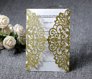 Detailed laser-cut gold glitter invitation cover with Hello 40 white printed insert card