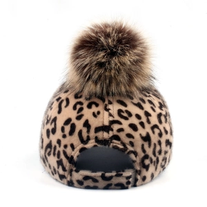 Women's leopard print baseball cap with brown faux fur pom pom and adjustable back strap