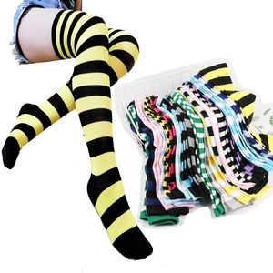 Detail view of colorful striped thigh-high socks in various patterns and color combinations
