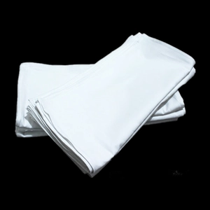 Stack of absorbent white cotton napkins for kitchen use on a high-contrast black background