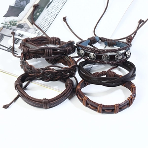 Set of 6 vintage braided leather bracelets in brown and black with star studs