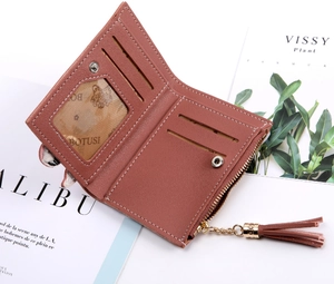 Detail view of brown PU leather wallet interior with card slots and tassel zipper pocket