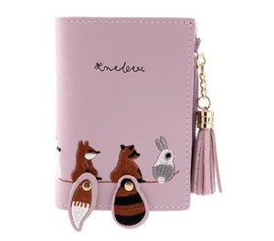 Close-up of pink PU leather wallet with cute animal embroidery and tassel zipper detail