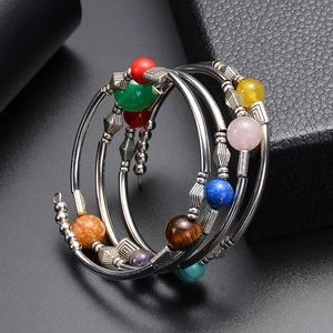 Multi-layer spiral wrap bracelet with turquoise, agate, and colorful beads on silver metal