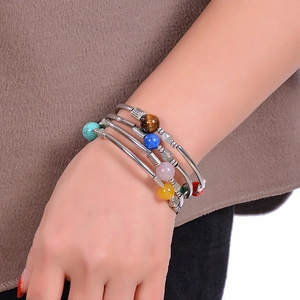 Close-up of multilayered beaded wrap bracelet with natural turquoise and tiger eye stones