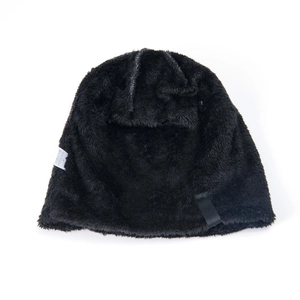 Close-up of thick fleece lining and wash label inside a warm winter knitted beanie