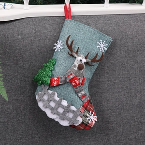 Blue linen Christmas stocking with 3D reindeer and snowflake decorations for gift bags