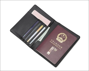 Inside view of black leather RFID passport holder with card slots and organized pockets
