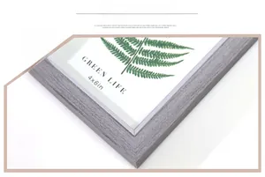 Detail of grey wood grain photo frame with modern corner craftsmanship and 4x6 texture