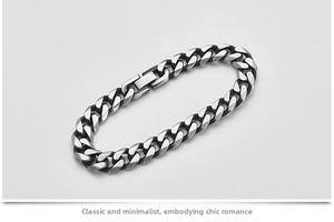 Macro shot of polished titanium steel cuban link bracelet with rectangular clasp closure