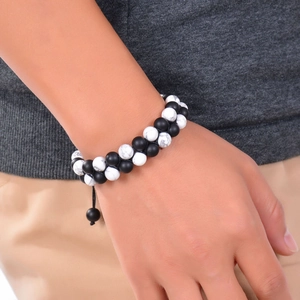 Detail of double-layer natural matte stone bracelet with adjustable black braided rope