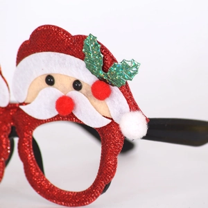 Detail of red glitter Santa Claus party glasses with white felt beard and holly leaf accents
