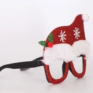 Detail of Christmas party glasses featuring a glittery red Santa hat and snowflakes