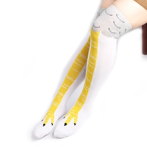 Detail of creative chicken feet patterned over-the-knee socks with knitted texture