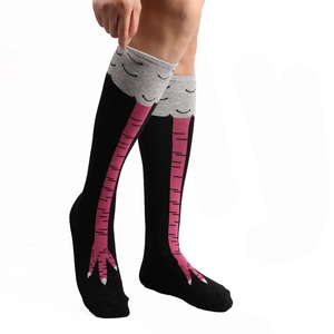 Funny over-the-knee cotton socks featuring pink chicken feet pattern on black fabric