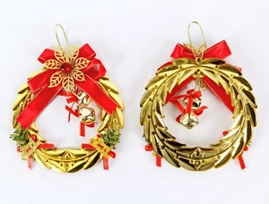 Close-up of festive Christmas wreaths with red bows and gold bells for tree decoration