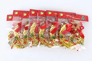 Detailed view of five golden Christmas wreaths with red bows and Merry Christmas signs
