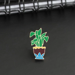 Enamel potted plant brooch with green leaves and blue base for clothing decoration
