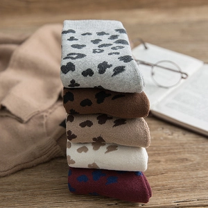 Five pairs of thick leopard print knit cotton crew socks in assorted vintage autumn colors