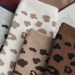 Thick leopard print cotton socks in earth tones featuring warm ribbed cuffs for women