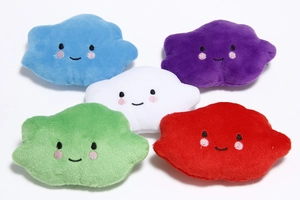 Flat lay of five colorful cloud plush toys with smiling faces on white background