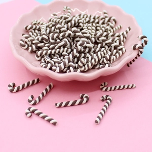 Handmade brown and white mini clay candy cane charms for DIY crafts and decor