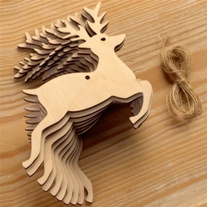 Detailed close-up of stacked wooden reindeer pendants with natural grain and jute rope twine