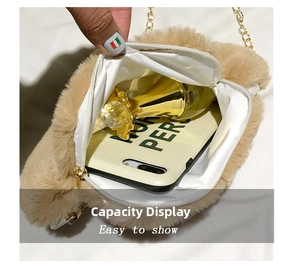Detailed view of plush cat paw crossbody bag showing interior space for phone and perfume