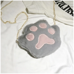 Detail of plush cat paw crossbody bag with soft grey faux fur and pink paw pads