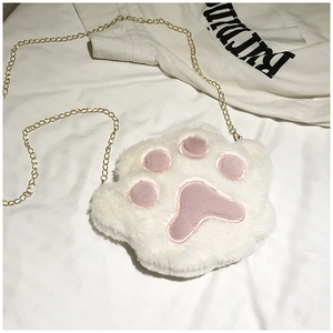 Detail shot of the plush white cat paw crossbody bag featuring soft pink embroidery padding