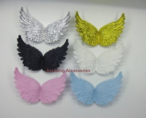 Macro detail of various colorful plastic angel wings accessories for DIY crafts decoration