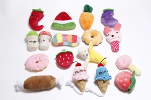Detailed view of a 15-piece plush pet toy set featuring watermelon and carrot shapes