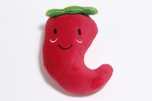 Detail of red chili plush dog toy with soft texture and embroidered face features