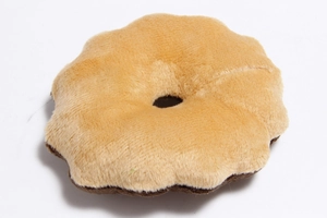 Detailed texture of brown plush doughnut-shaped pet toy with soft fabric and round design