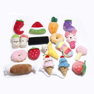 Detailed view of various plush dog toys in food shapes with phone for size reference