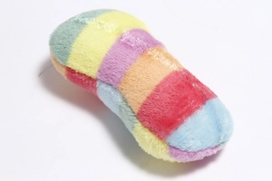 Detailed close-up of rainbow striped plush pet toy with soft multicolored long fur texture