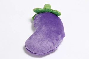 Detailed view of a purple eggplant plush dog toy with soft texture and green leaves