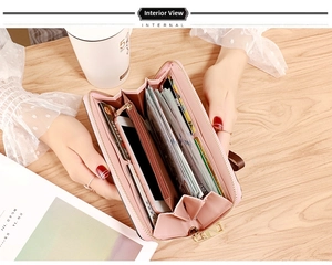 Detailed interior of long zip-around wallet showing card slots and phone pocket