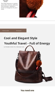Detail of dark brown leather backpack featuring a plush red pompom and textured finish