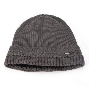 Detailed knit texture of dark gray winter beanie with a metallic CLASSIC label