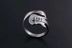 Detailed close-up of a silver electric guitar ring with visible strings and pickups