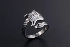 Detailed view of vintage guitar shaped open ring with intricate strings and chrome finish