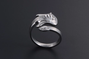 Close-up of adjustable silver guitar ring with detailed fretboard and body design