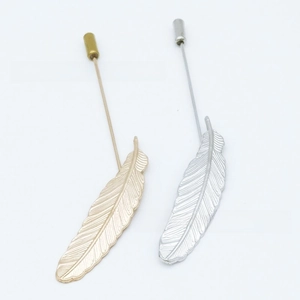Detailed close-up of alloy feather lapel pins in gold and silver finish with safety caps