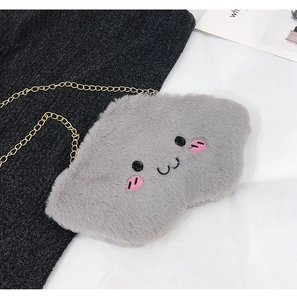 Detail of grey plush cloud bag with cute embroidery and golden metal chain strap