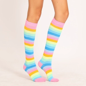 Close-up showing the elastic cuff and vibrant knitted texture of rainbow striped socks